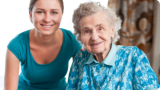 caregiver and patient smiling