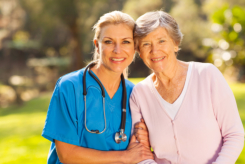 Woman nurse and old woman patient