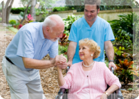 caregiver with patients in the garden
